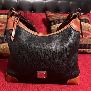 Dooney and Bourke black and tan leather handbag! In very good condition!